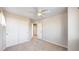 Bedroom with neutral carpet, ceiling fan, and a double-door closet at 9567 W 107Th Dr, Broomfield, CO 80021