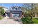 Inviting two-story home with solar panels, brick accents, two-car garage, and well-maintained landscaping at 9567 W 107Th Dr, Broomfield, CO 80021