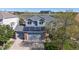 Charming two-story home with a gray roof, brick accents, solar panels, and a two-car garage at 9567 W 107Th Dr, Broomfield, CO 80021