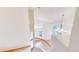 Bright foyer with a curved staircase and a view to the living area below at 9567 W 107Th Dr, Broomfield, CO 80021