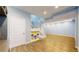 Spacious living room featuring a staircase, wood floors and blue walls at 9567 W 107Th Dr, Broomfield, CO 80021