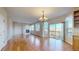 Elegant living room with hardwood floors, a fireplace, and sliding glass doors to a deck at 9567 W 107Th Dr, Broomfield, CO 80021