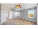 Bright main bedroom with carpet, vaulted ceiling, ceiling fan and ample natural light at 9567 W 107Th Dr, Broomfield, CO 80021