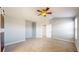 Large main bedroom features neutral carpet, fan, and attached bath at 9567 W 107Th Dr, Broomfield, CO 80021