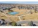 Features an aerial view of the community park including tennis courts, playground, and walking paths at 12500 Meade Ct, Broomfield, CO 80020