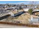 Aerial view of a spacious fenced backyard with patio area, shed, and a well maintained lawn at 12500 Meade Ct, Broomfield, CO 80020
