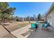 Expansive backyard with a patio, shed, grassy area, and mature trees for outdoor enjoyment at 12500 Meade Ct, Broomfield, CO 80020