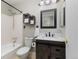 Bathroom with dark wood vanity and accent fixtures, along with a tub and shower at 12500 Meade Ct, Broomfield, CO 80020