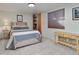 Comfortable bedroom with natural wood accents and ample light from a large window, creating a serene space at 12500 Meade Ct, Broomfield, CO 80020