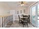 Dining room area with access to the backyard through sliding glass doors and access to stairs at 12500 Meade Ct, Broomfield, CO 80020