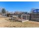 A dog kennel in a well-maintained yard at 12500 Meade Ct, Broomfield, CO 80020