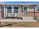 Inviting front porch with seating, offering a cozy and welcoming entry to the home at 12500 Meade Ct, Broomfield, CO 80020