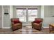 Cozy seating area with large windows, hardwood floors, and a relaxing ambiance at 12500 Meade Ct, Broomfield, CO 80020