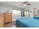 Spacious main bedroom featuring hardwood floors, a large window and mirrored closets at 12500 Meade Ct, Broomfield, CO 80020