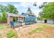 Backyard featuring patio furniture, storage shed, and spacious yard at 544 S Victor Way, Aurora, CO 80012