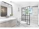 Modern bathroom with sleek vanity, toilet, and stylish glass-enclosed shower at 544 S Victor Way, Aurora, CO 80012