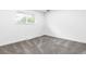 Bedroom with plush carpet, neutral decor, and a large window for plenty of sunlight at 544 S Victor Way, Aurora, CO 80012