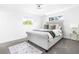 Bright bedroom with plush carpet, a comfortable bed, and large windows for natural light at 544 S Victor Way, Aurora, CO 80012