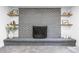Close up of a stylish brick fireplace with decorative shelving at 544 S Victor Way, Aurora, CO 80012