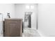 Laundry room with modern washer and dryer, clean design, and convenient mirror at 544 S Victor Way, Aurora, CO 80012