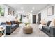 Bright living room with gray sofas and stylish decor, creating a cozy and inviting space at 544 S Victor Way, Aurora, CO 80012