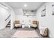 Cozy sitting area with patterned chairs, decorative shelving, and a soft rug at 544 S Victor Way, Aurora, CO 80012