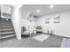 Comfortable sitting area featuring patterned chairs, decorative shelving, and a cozy rug at 544 S Victor Way, Aurora, CO 80012