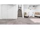 Sitting area with decorative chairs and a view of an adjacent stairway at 544 S Victor Way, Aurora, CO 80012