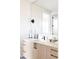 Modern bathroom with light wood vanity and white quartz countertop at 2471 Quitman St, Denver, CO 80212