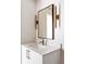 Stylish bathroom vanity with a modern mirror and light fixtures at 2471 Quitman St, Denver, CO 80212