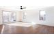 Bright bedroom featuring hardwood floors and sliding doors to deck at 2471 Quitman St, Denver, CO 80212