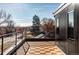 Private rooftop deck with city views and wood tile flooring at 2471 Quitman St, Denver, CO 80212