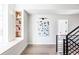 Bright hallway with built-in shelving and modern staircase at 2471 Quitman St, Denver, CO 80212