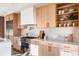 Kitchen features white quartz countertops and light wood cabinetry at 2471 Quitman St, Denver, CO 80212