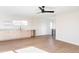 Modern wet bar with light wood cabinets and floating shelves at 2471 Quitman St, Denver, CO 80212