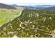 Stunning mountain view, featuring lush greenery and scattered homes that offer a serene and private living environment at 2907 Hiwan Dr, Evergreen, CO 80439