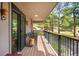 Balcony with outdoor seating, offering a view of the trees and natural surroundings at 2907 Hiwan Dr, Evergreen, CO 80439