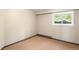 Bedroom with bright window and neutral colors ready for your vision at 2907 Hiwan Dr, Evergreen, CO 80439