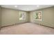 Bright bedroom with two large windows offering an abundance of natural light at 2907 Hiwan Dr, Evergreen, CO 80439