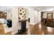 Bright foyer featuring hardwood floors, stylish console table, and staircase at 2907 Hiwan Dr, Evergreen, CO 80439