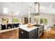 Bright, open-concept kitchen with modern appliances and stylish island, connecting seamlessly to the dining and living areas at 2907 Hiwan Dr, Evergreen, CO 80439