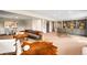 Spacious living room features a stylish gray couch and custom built-in shelving at 2907 Hiwan Dr, Evergreen, CO 80439