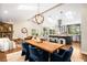 Open-concept living space with vaulted ceilings, fireplace, skylights and modern dining area at 2907 Hiwan Dr, Evergreen, CO 80439