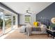 Spacious main bedroom with deck access, built-ins, and mountain views at 2907 Hiwan Dr, Evergreen, CO 80439
