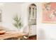 Inviting dining room with a view of a charming display cabinet through a delightful arched doorway at 2540 S Monroe St, Denver, CO 80210