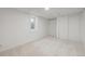 Clean basement with carpet, white walls, and storage closet at 1111 S Corona St, Denver, CO 80210
