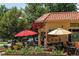 Charming neighborhood coffee shop with outdoor seating and vibrant greenery at 1111 S Corona St, Denver, CO 80210