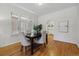 Bright dining room with hardwood floors and an open layout, perfect for entertaining guests at 1111 S Corona St, Denver, CO 80210