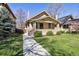 Beautiful home with a manicured lawn, complemented by a sidewalk leading to the welcoming front entrance at 1111 S Corona St, Denver, CO 80210
