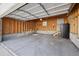 Spacious garage with concrete floor, door to backyard, and room for parking and storage at 1111 S Corona St, Denver, CO 80210